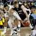 Michigan junior Jordan Morgan competes for possession of ball against Western Michigan senior Nate Hutcheson on Tuesday. Daniel Brenner I AnnArbor.com